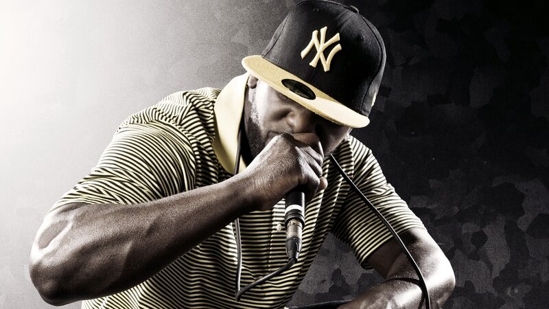 Man Rapping into Microphone