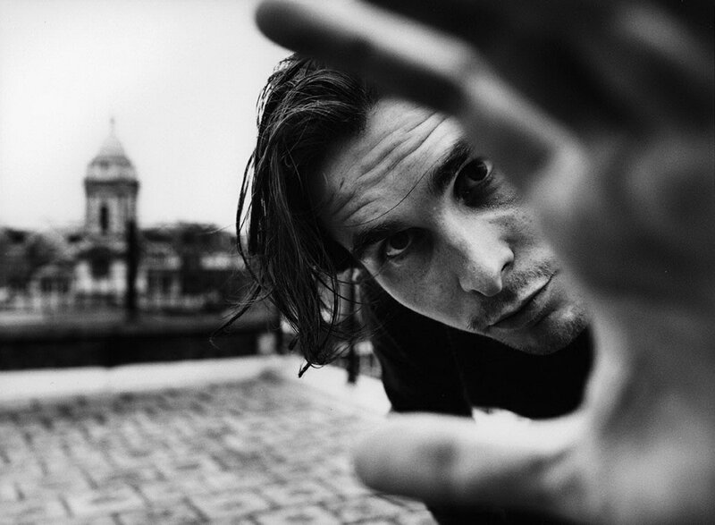man reaching toward camera
