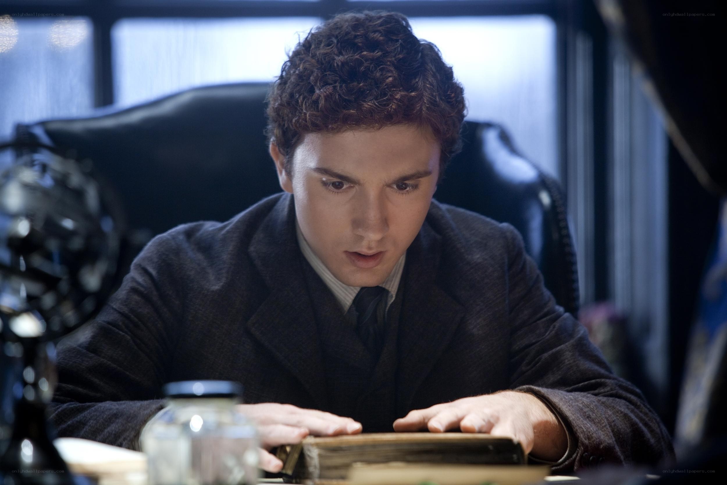 man reading at a desk