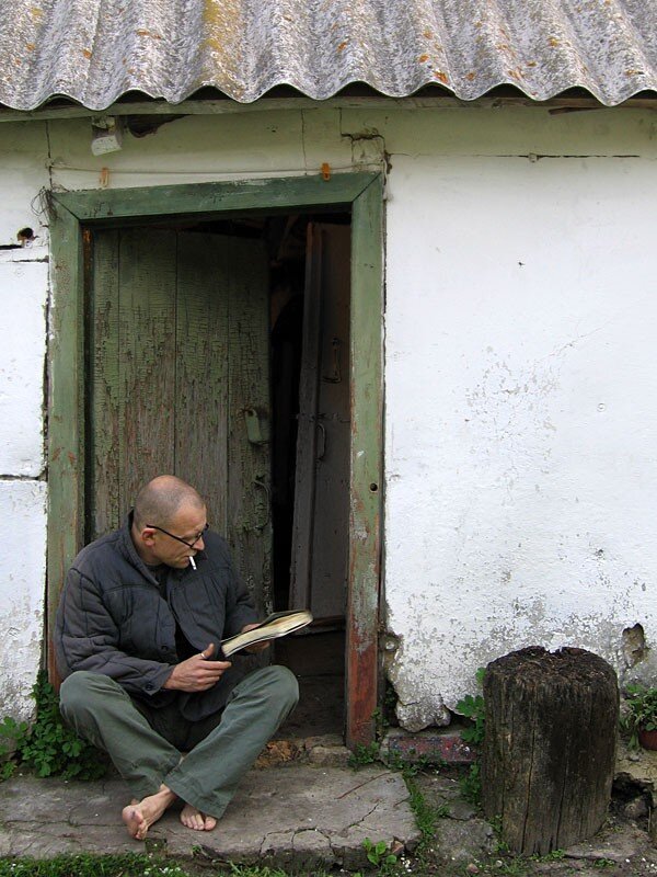 Man reading at doorway