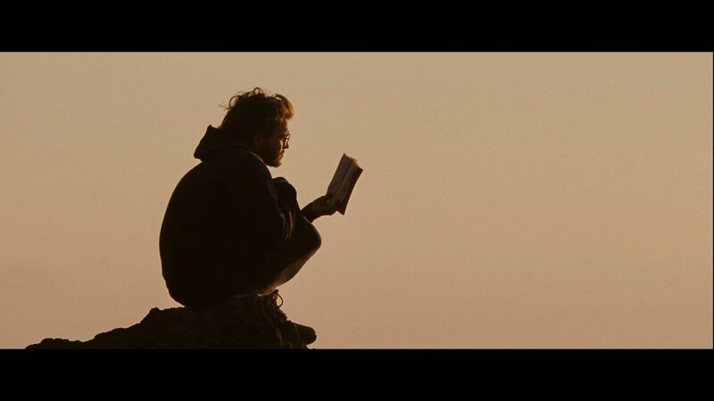 Man Reading Book — Brown, Serene, Sunset