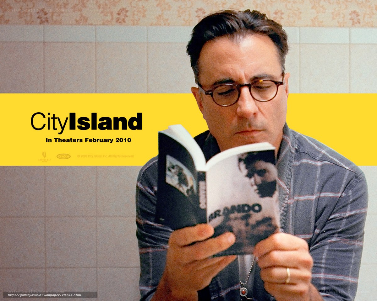 Man reading book in bathroom