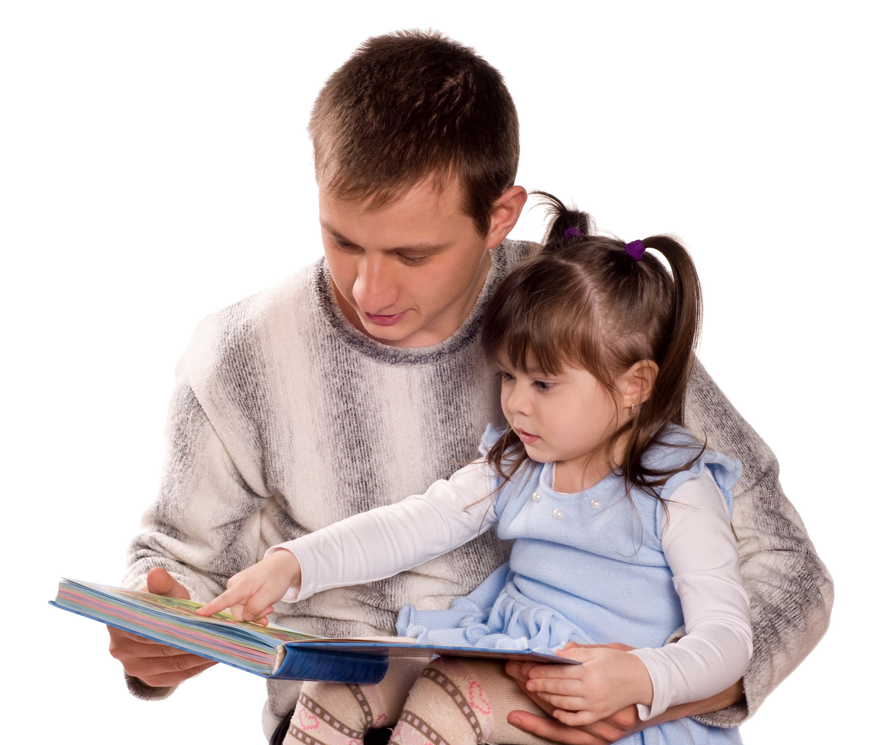 man reading book with child