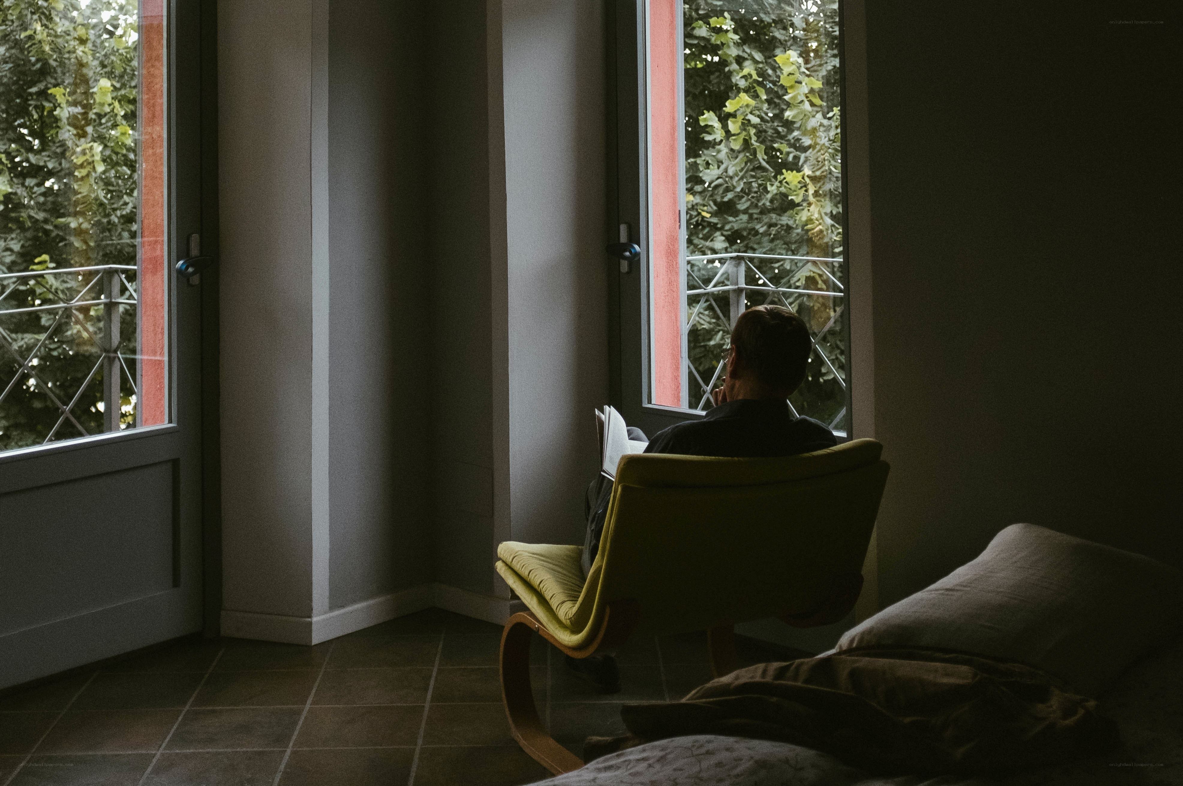Man reading by the window