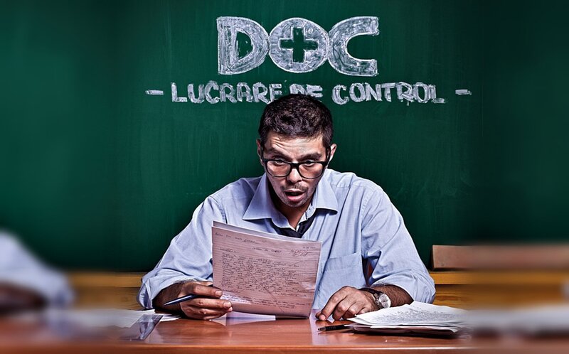 Man reading document at desk