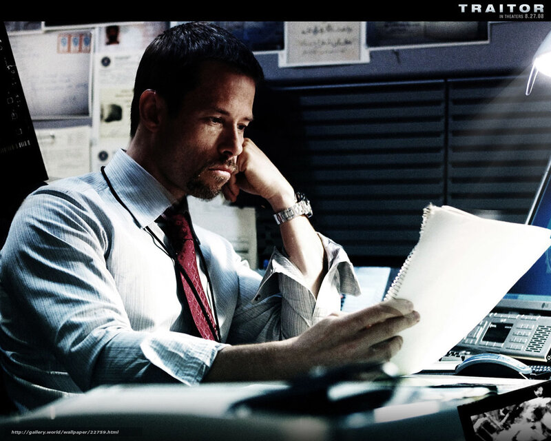 Man reading documents at desk