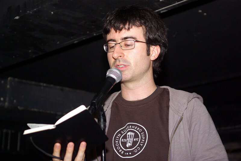 man reading from a book