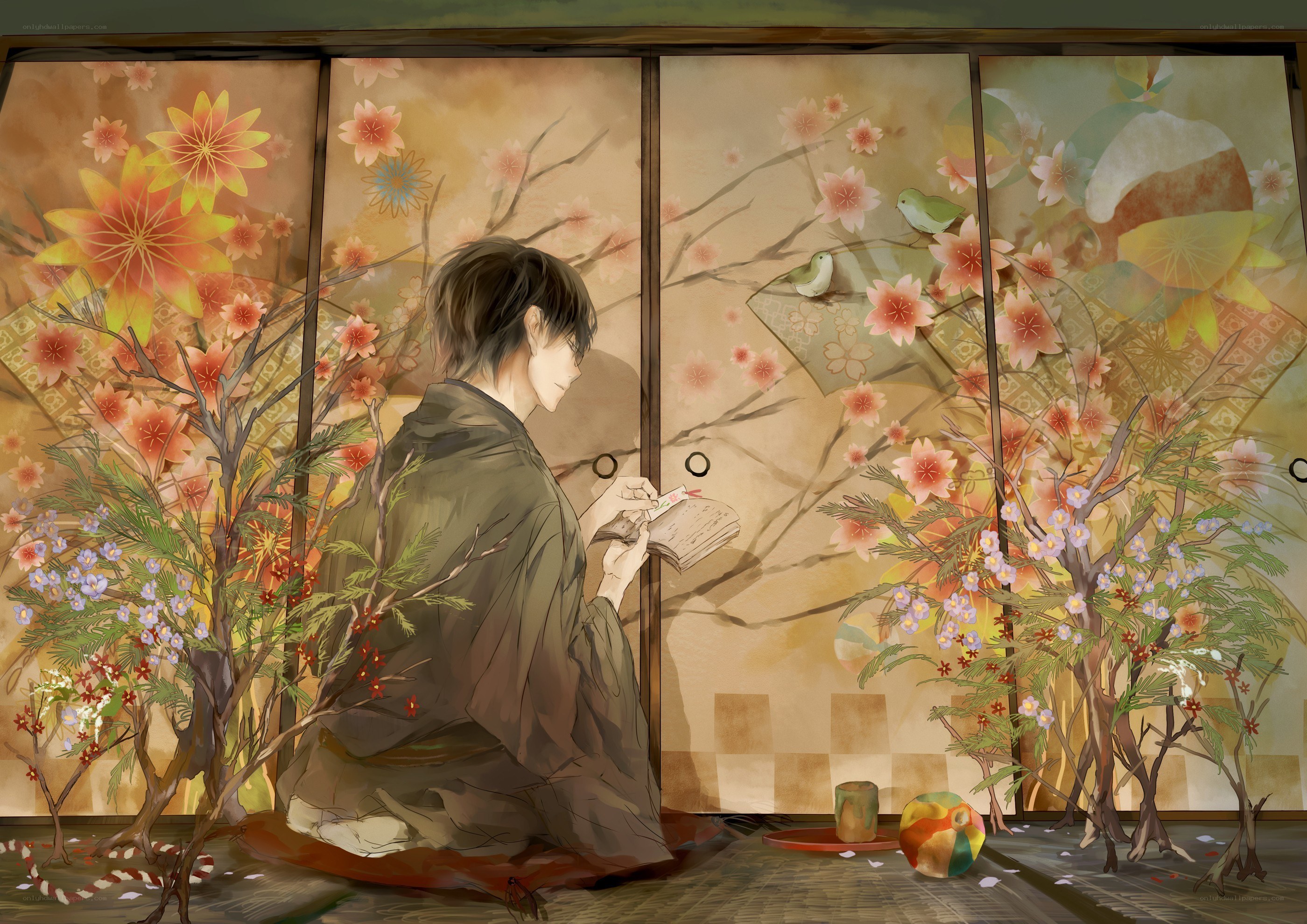 man reading in a floral room