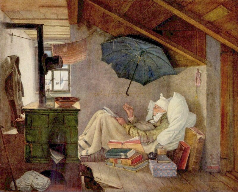 Man reading in attic room