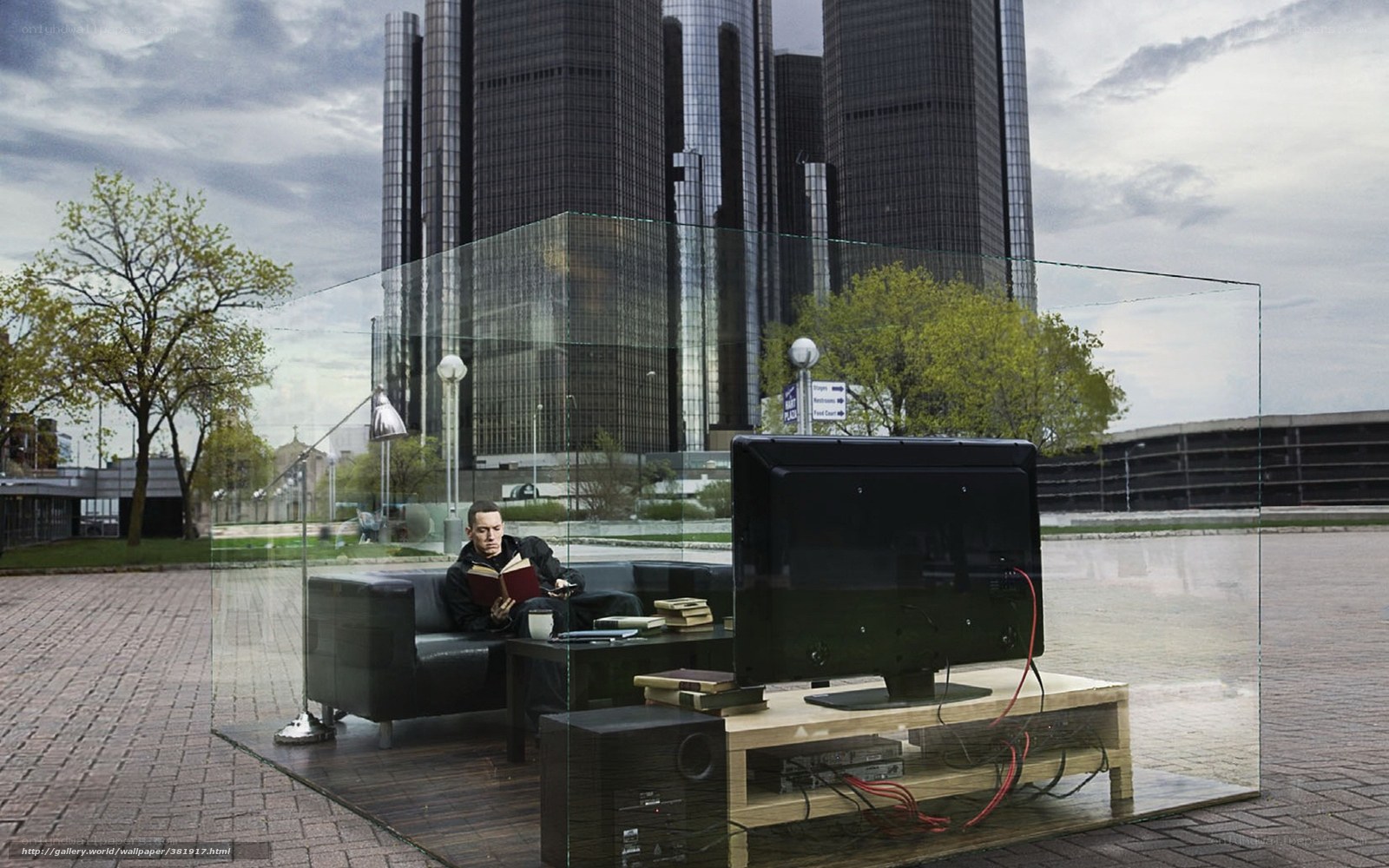Man reading in glass room