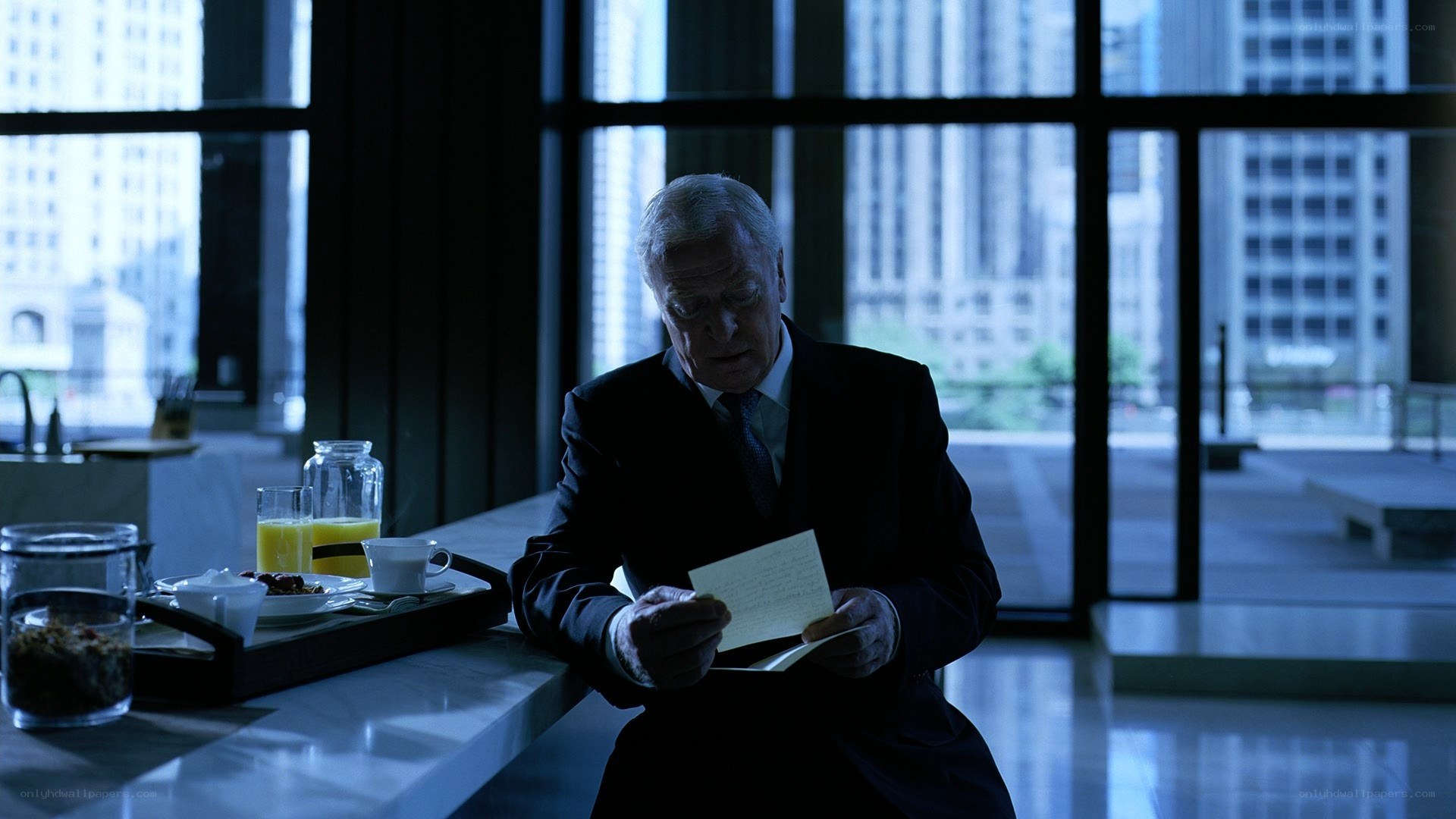 man reading letter at breakfast