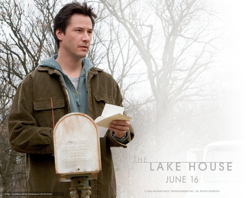 man reading letter by mailbox