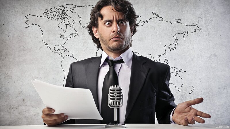 man reading news at desk