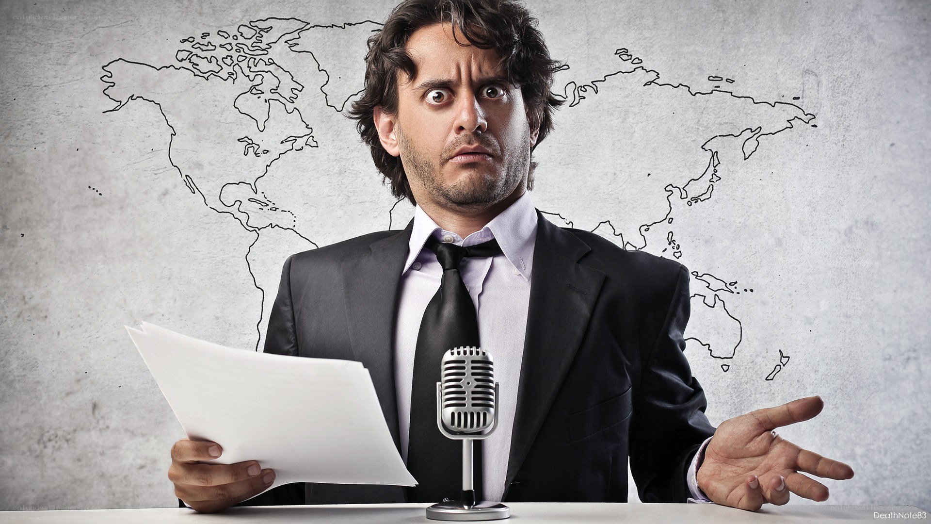 man reading news at desk
