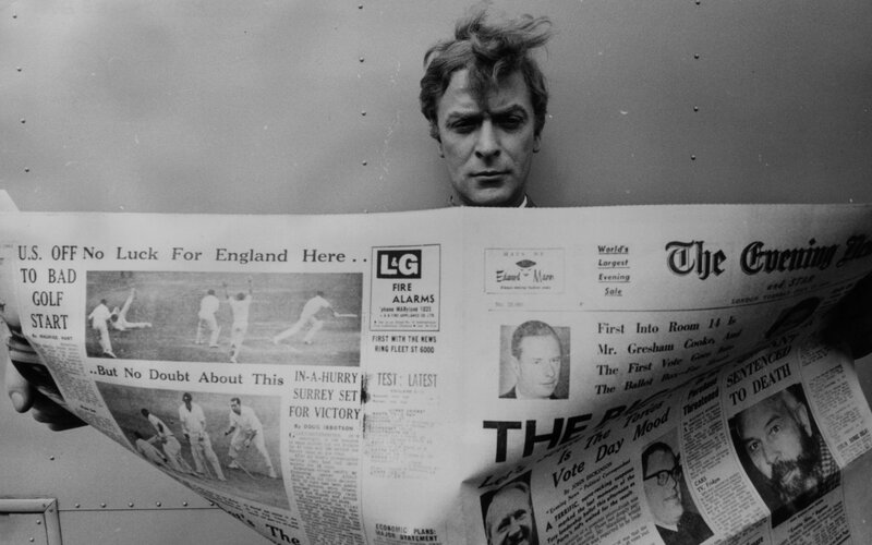 Man reading newspaper