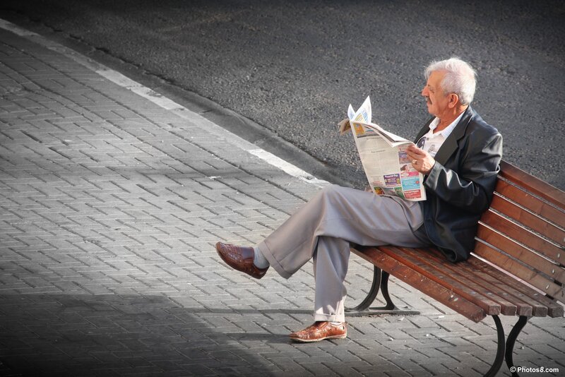 Man Reading Newspaper — Brown
