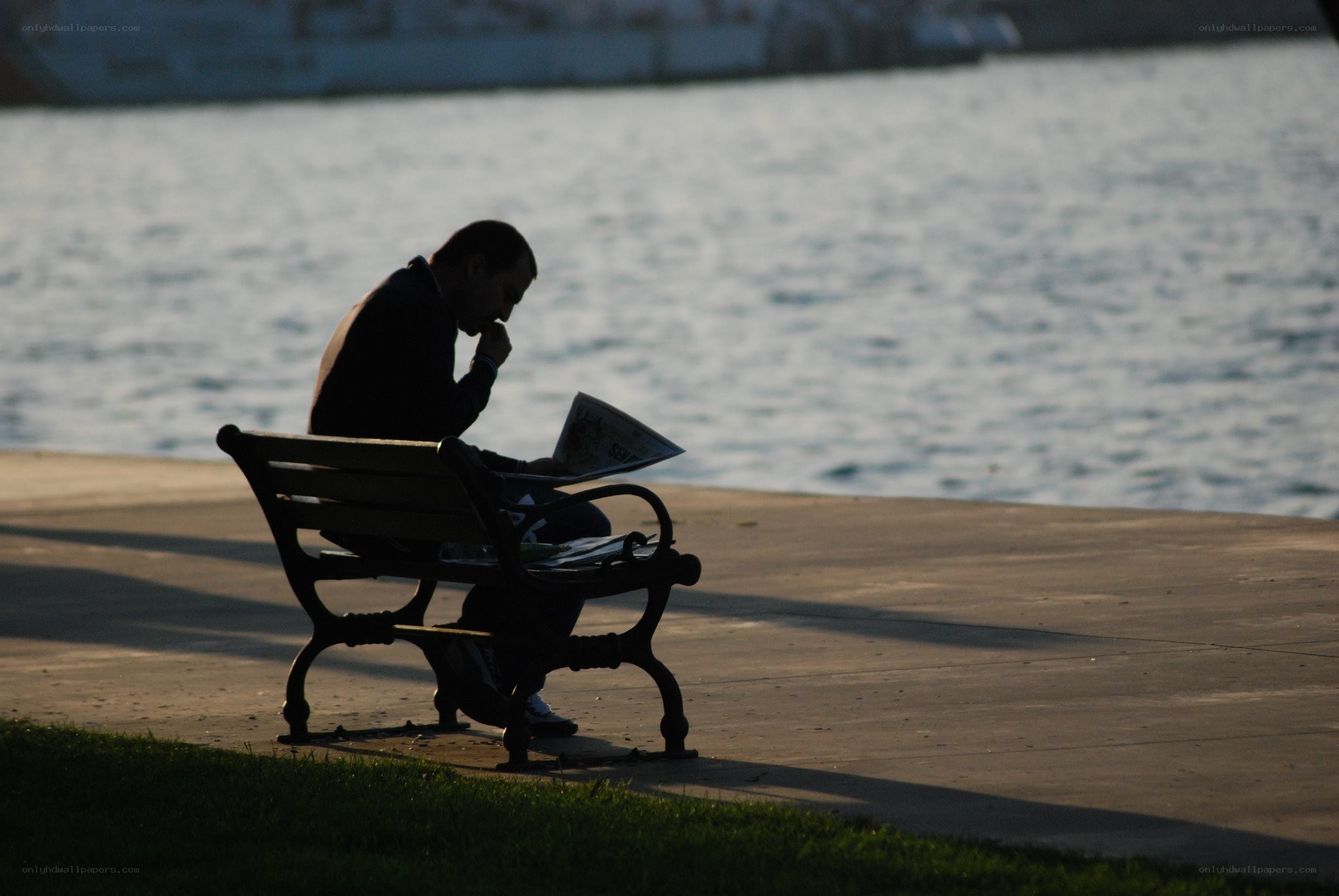 Man reading on a bench