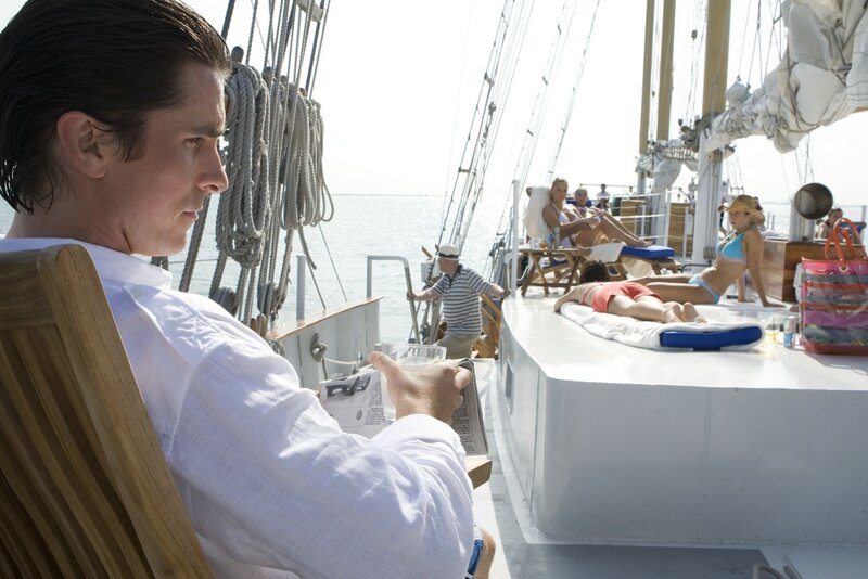 Man reading on a sailboat