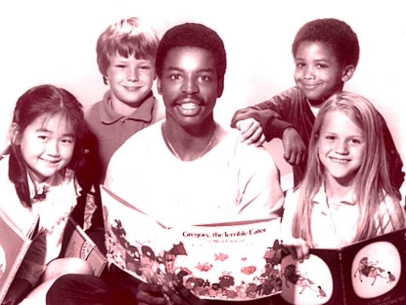 Man Reading to Children