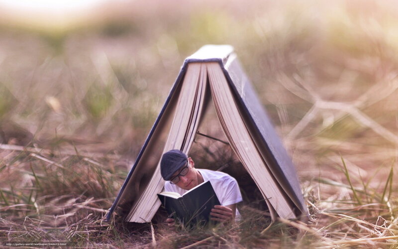 Man reading under book tent