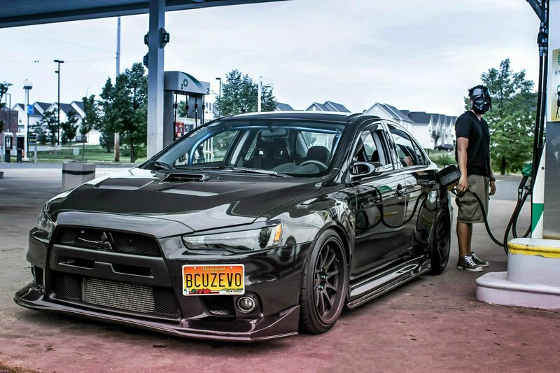 Man refueling black car