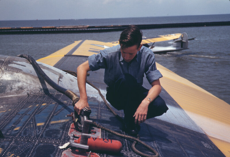 Man refueling seaplane