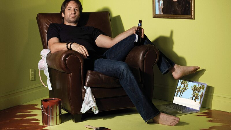 man relaxing in armchair