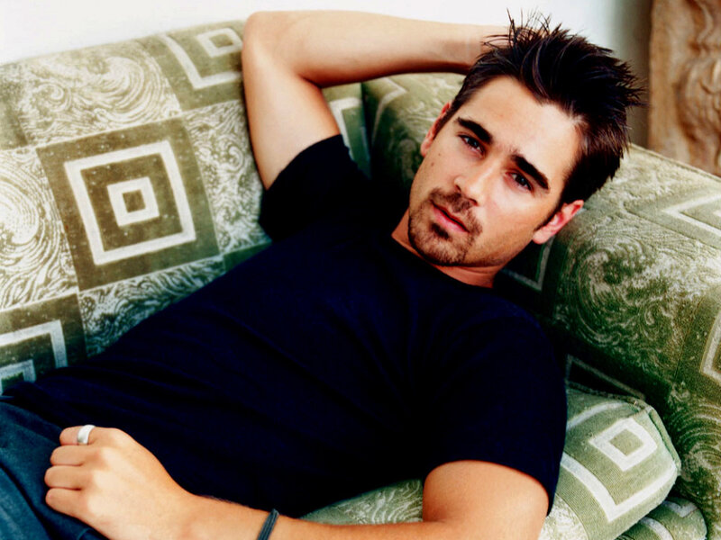 man relaxing on a patterned couch