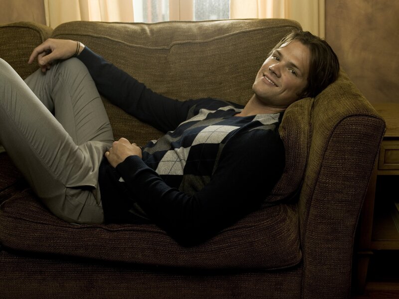 man relaxing on couch