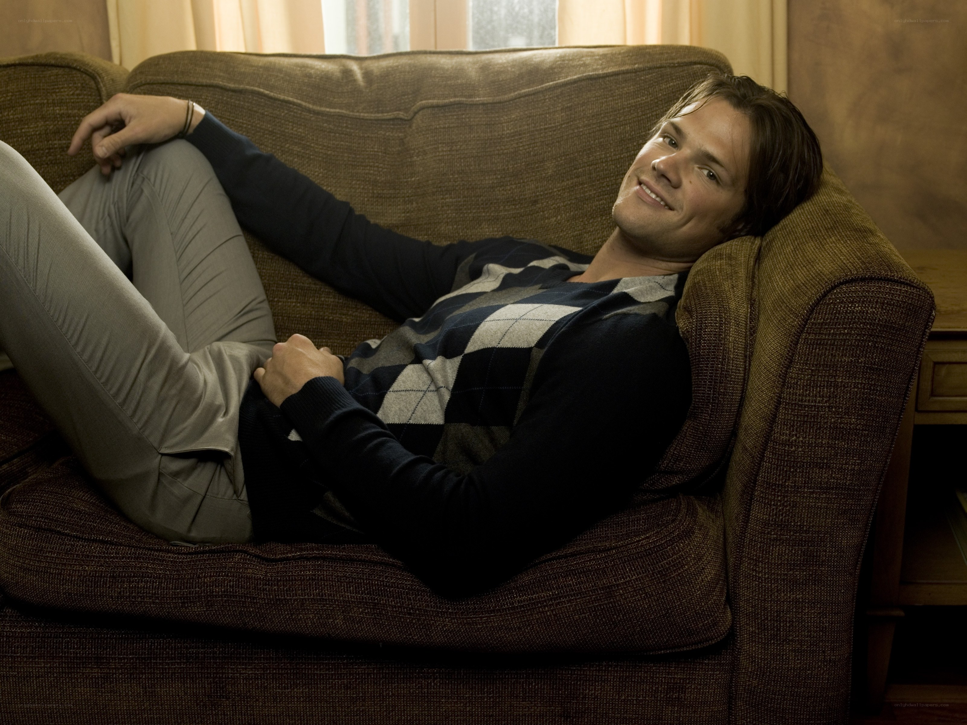 man relaxing on couch