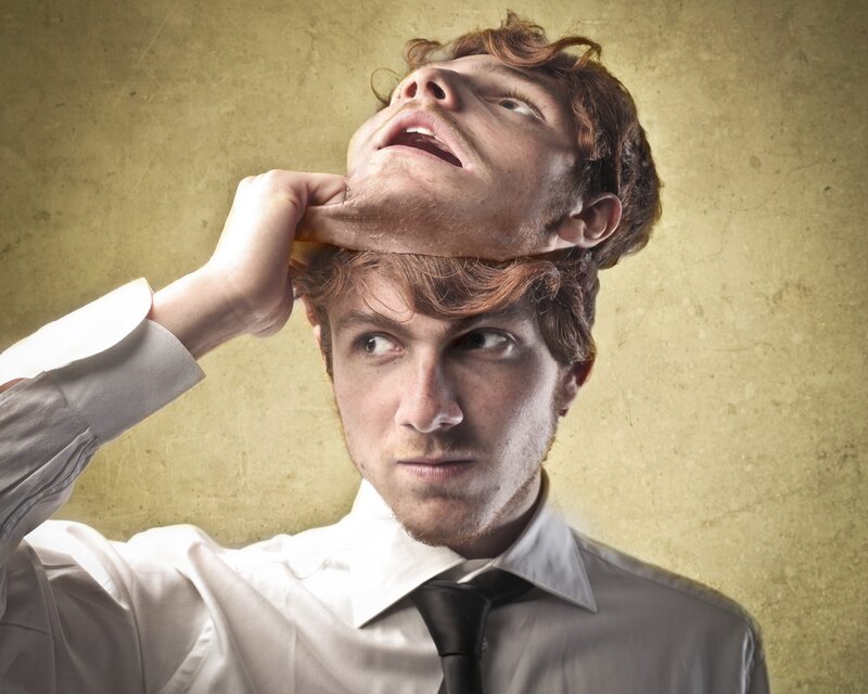 man removing face mask