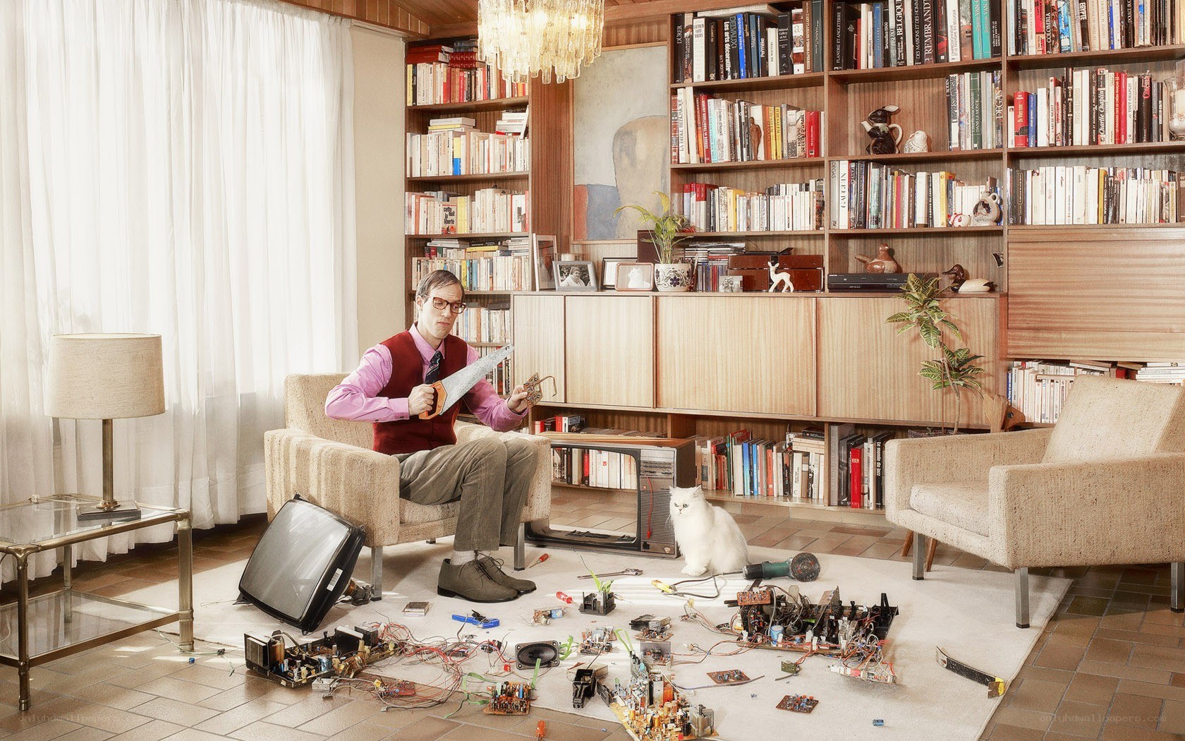 Man repairing electronics at home