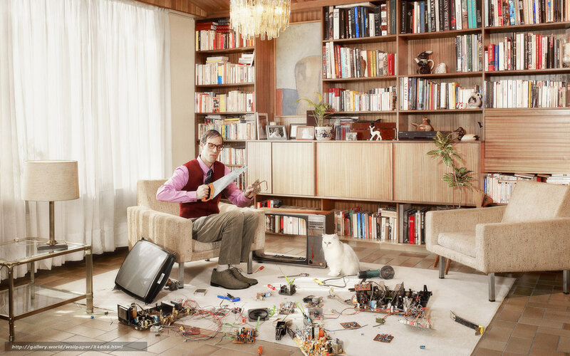 Man repairing electronics at home