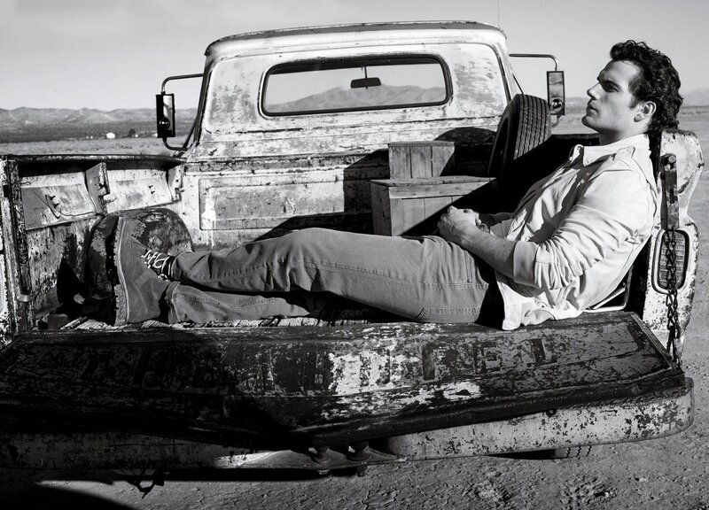 man resting in truck bed
