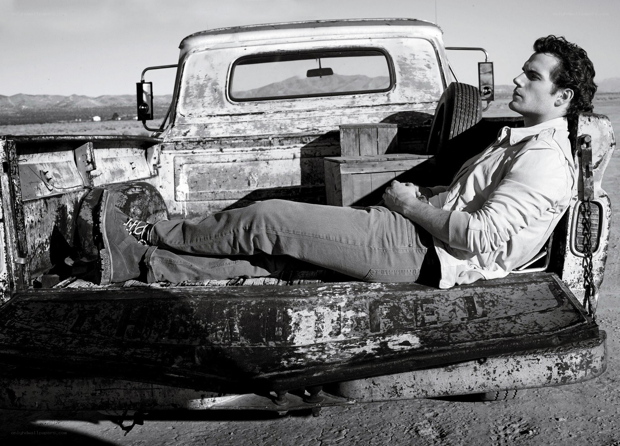 man resting in truck bed