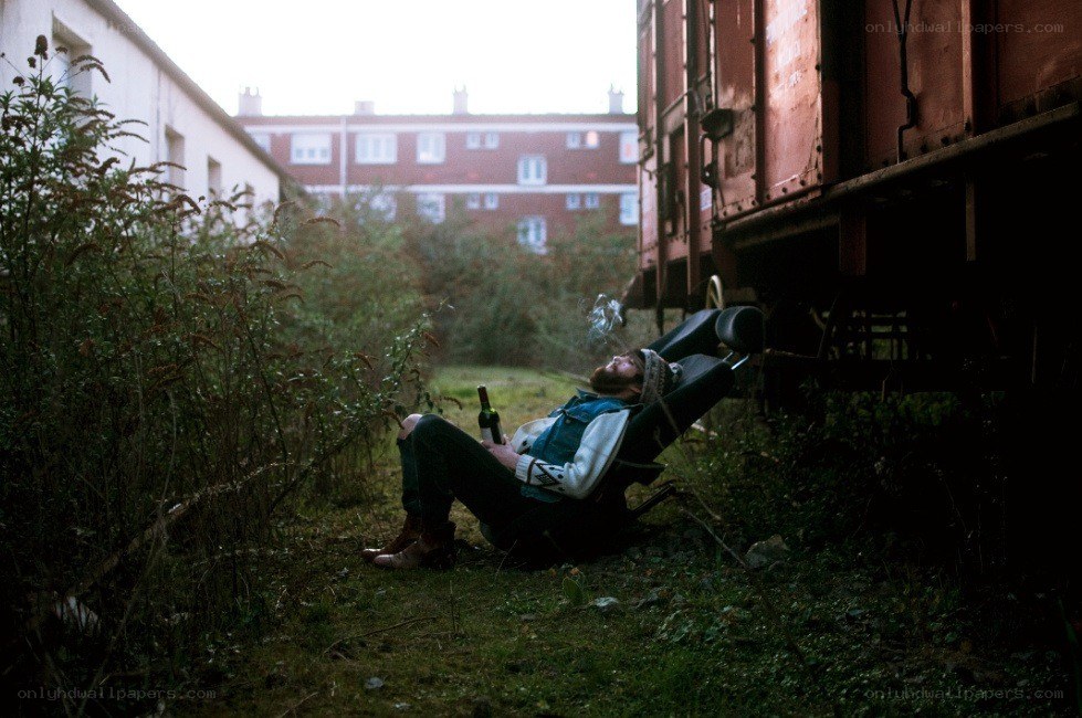 Man resting near train car