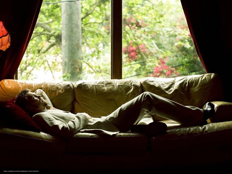 Man resting on a sofa