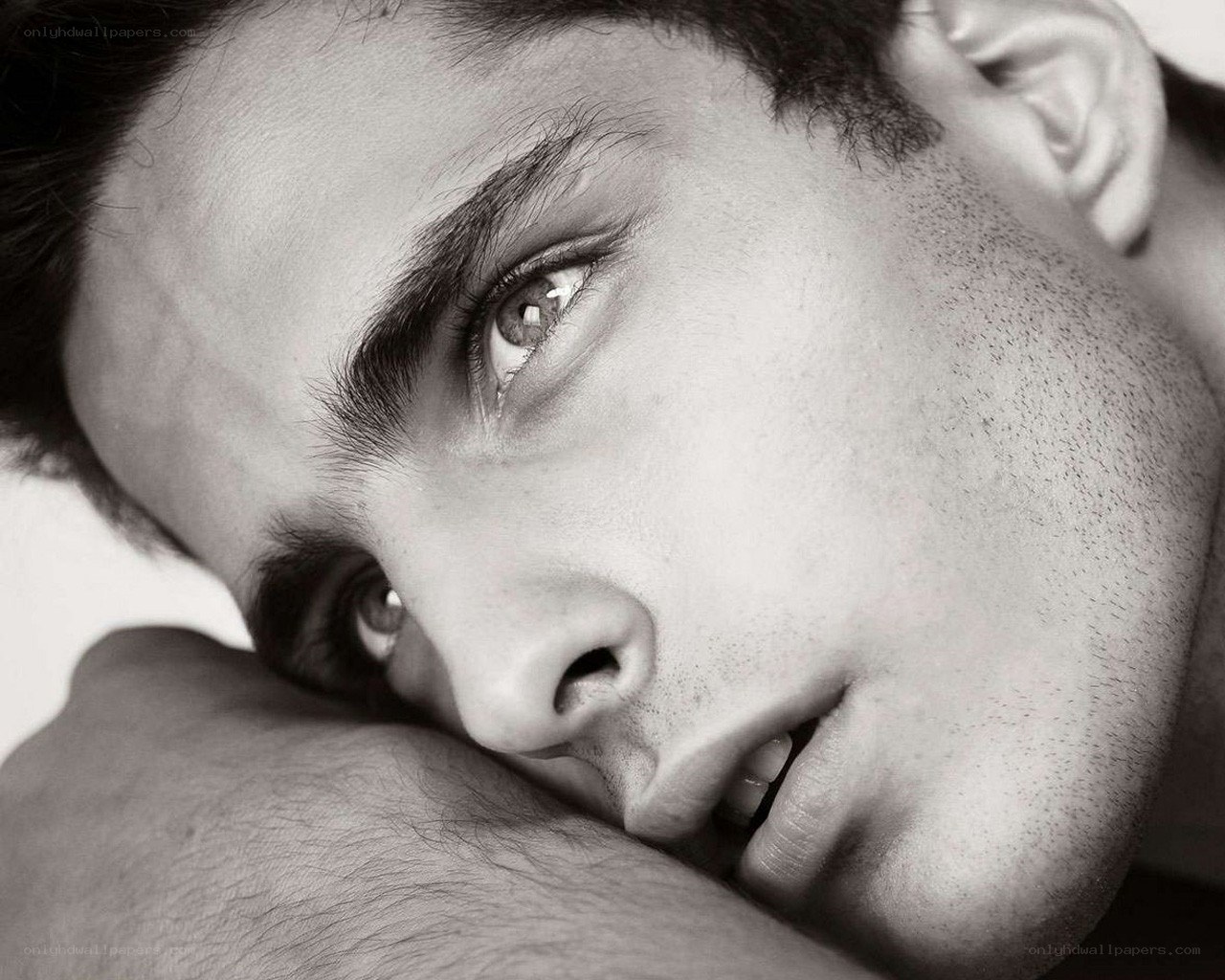 man resting on arm