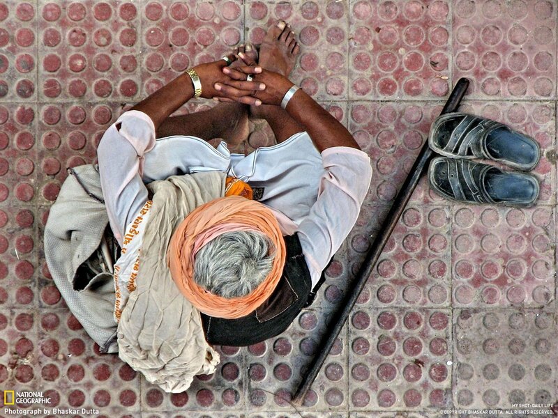 Man resting on tiled floor