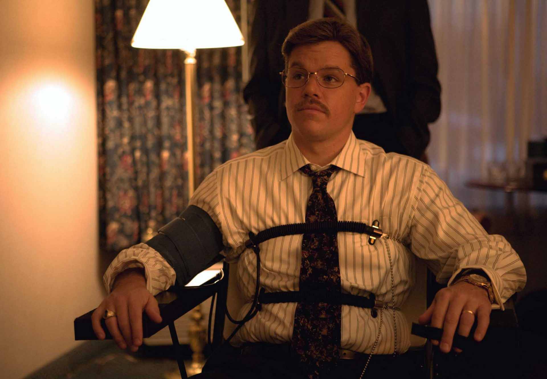 man restrained in chair