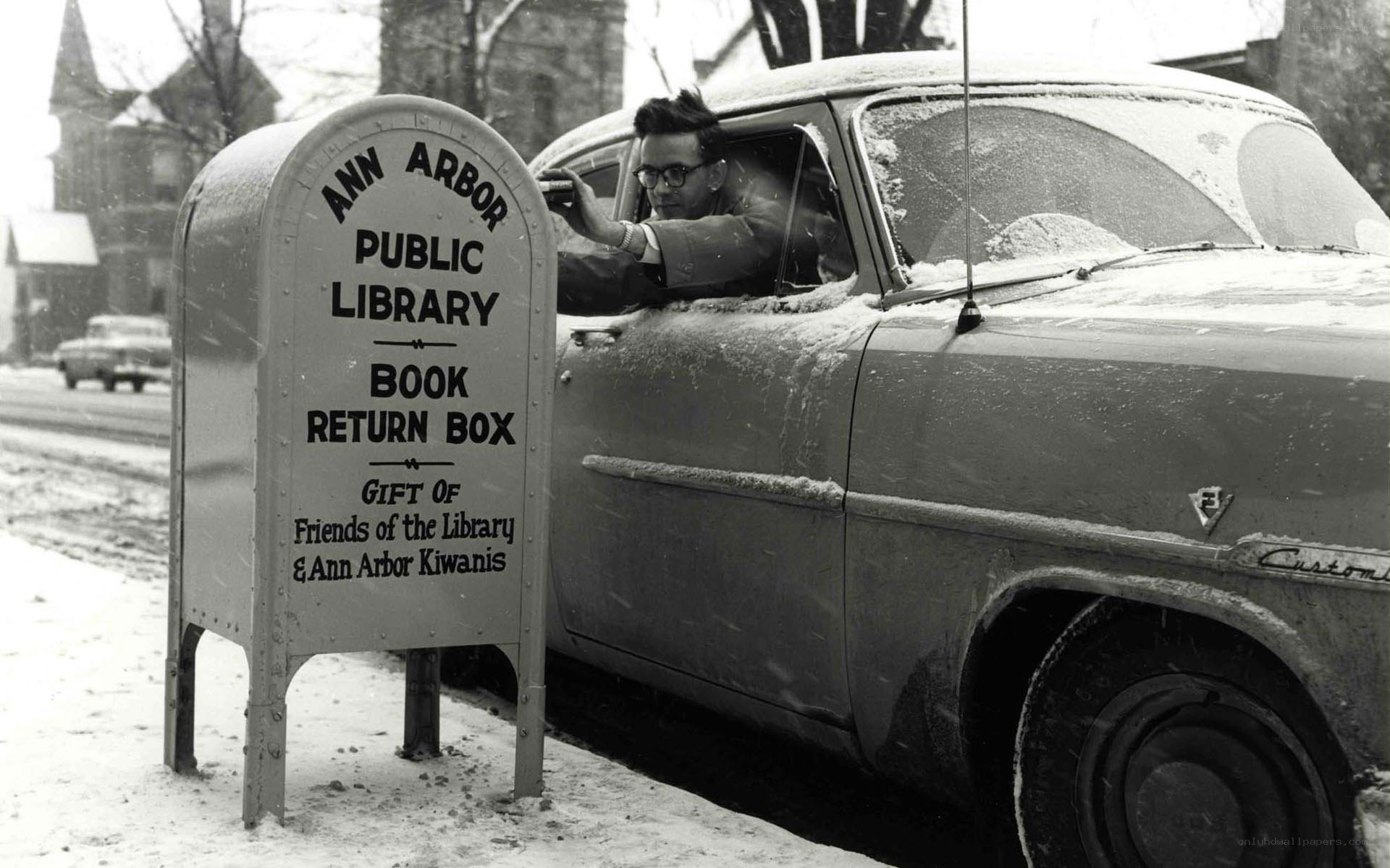 Man returns book in snow