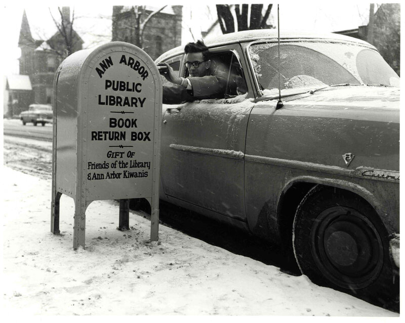 Man returns books in snow