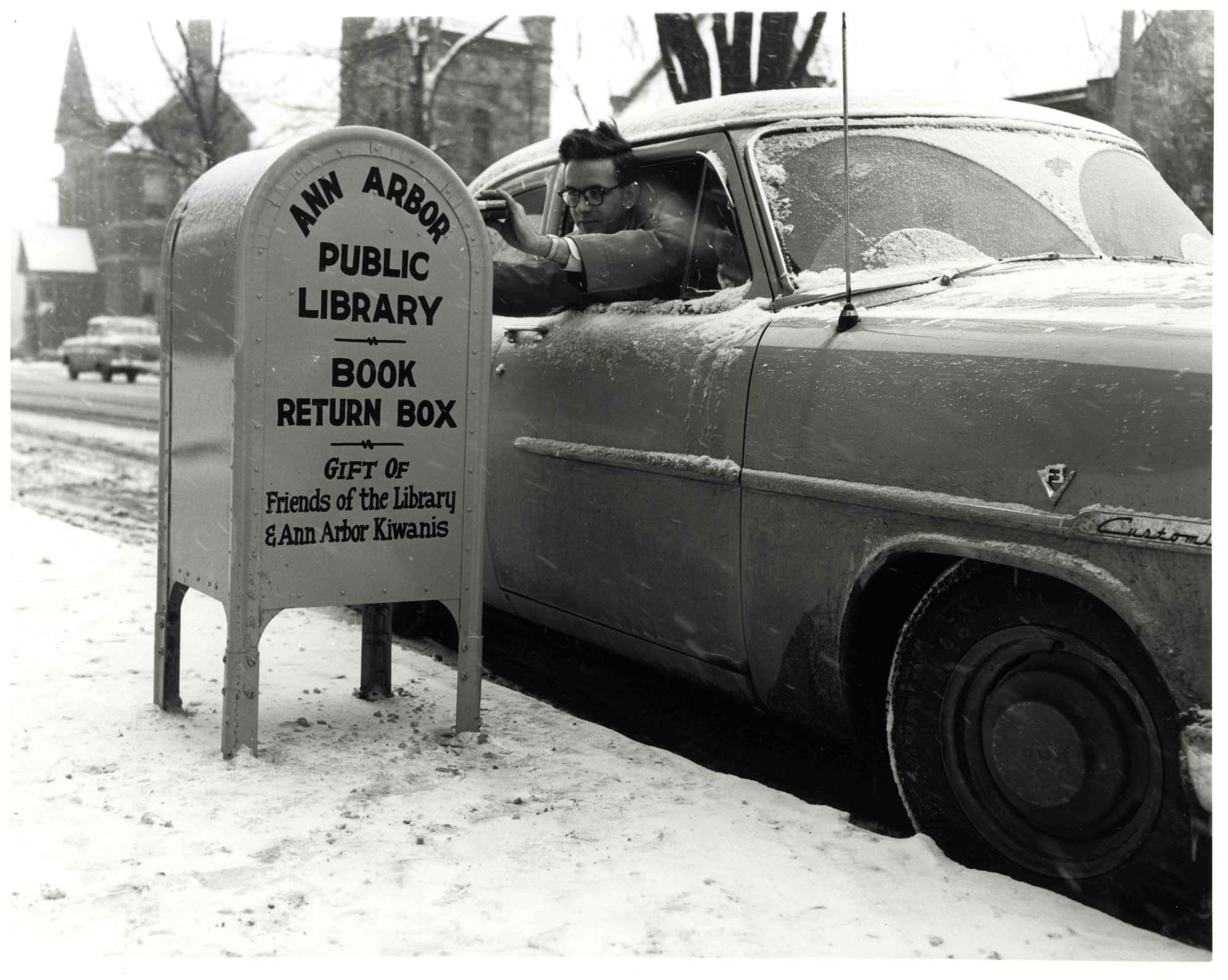 Man returns books in snow