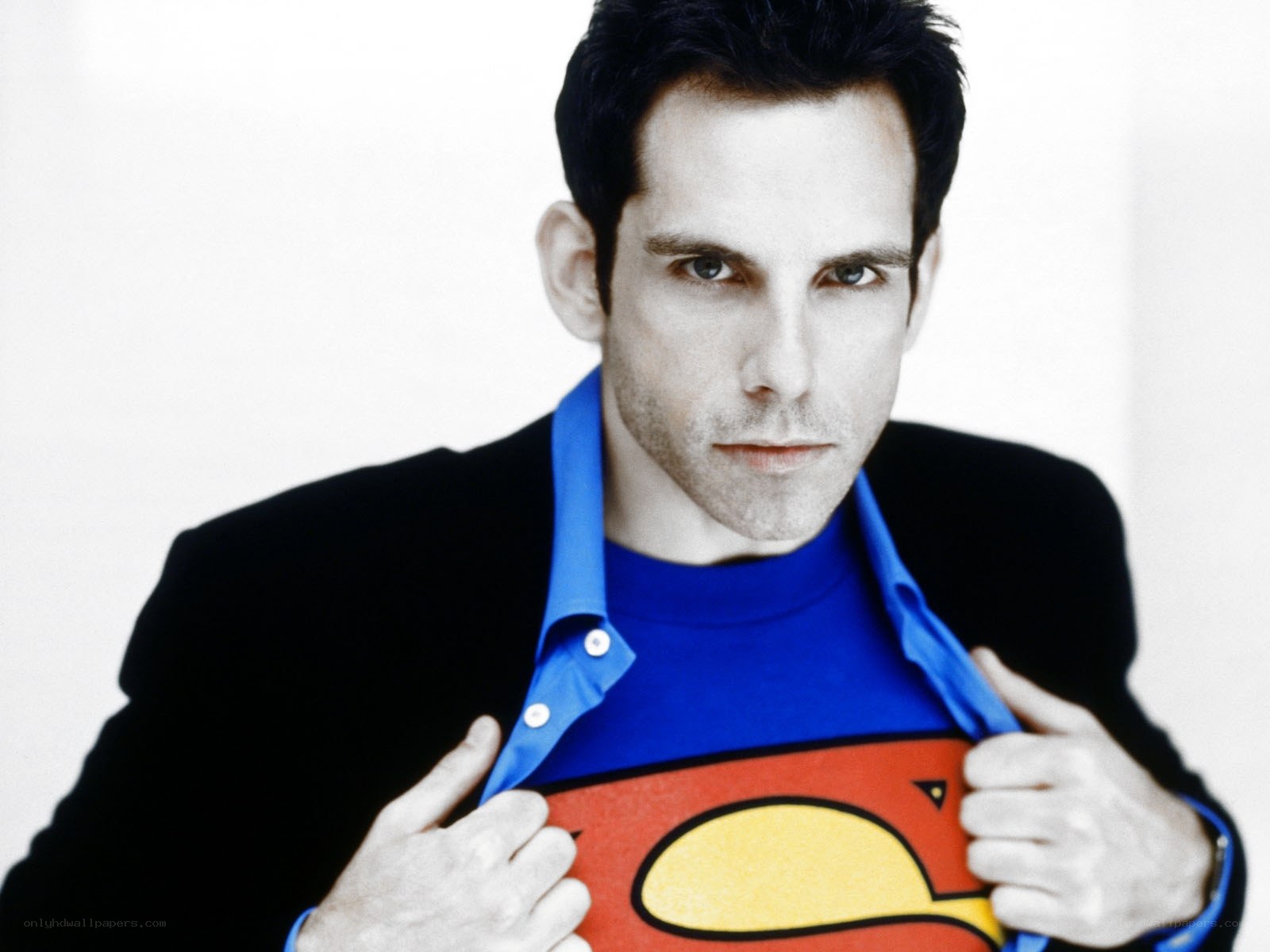 man revealing superman shirt