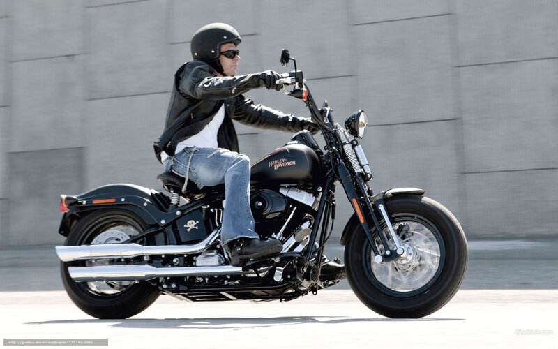 Man riding a black motorcycle