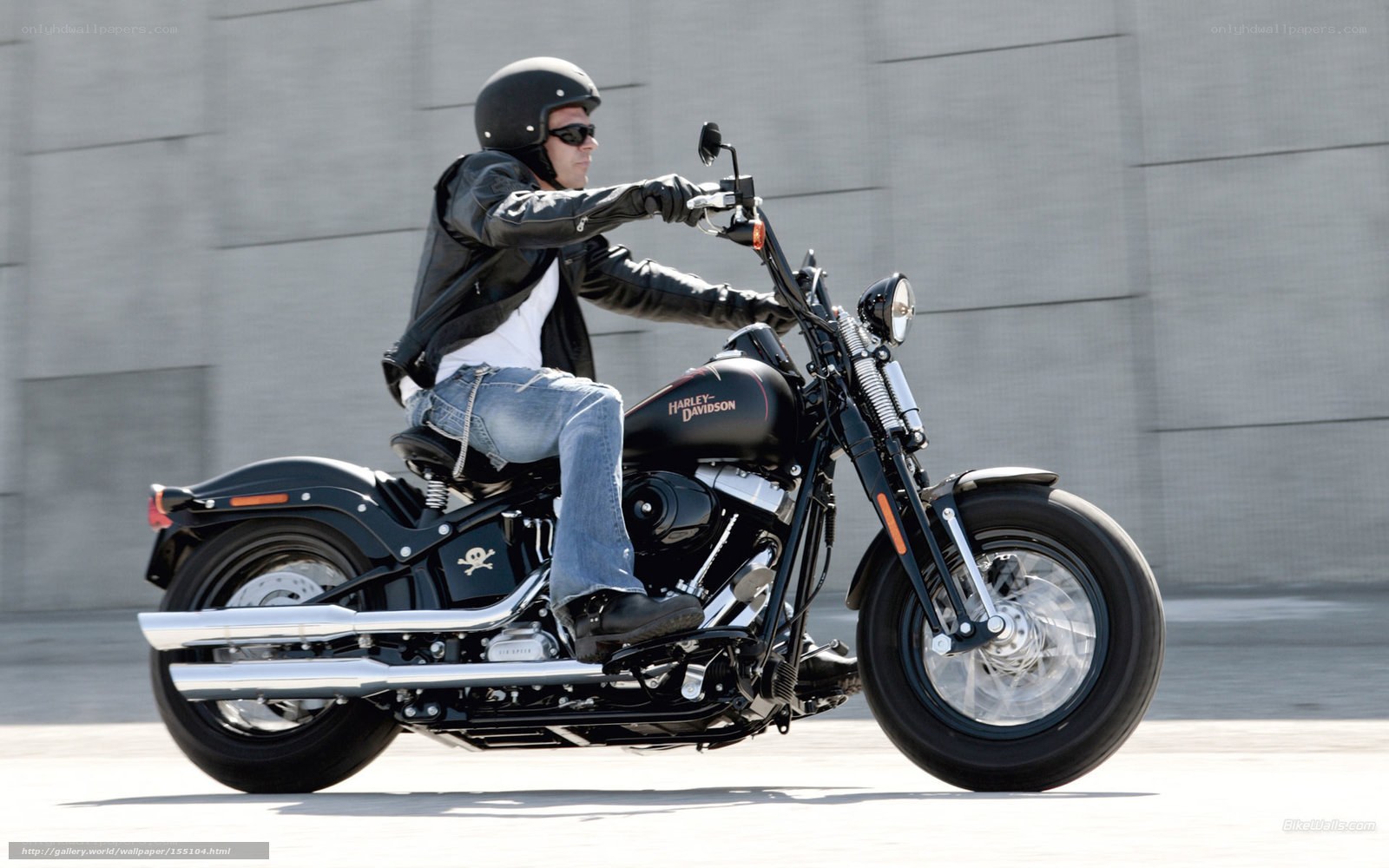 Man riding a black motorcycle