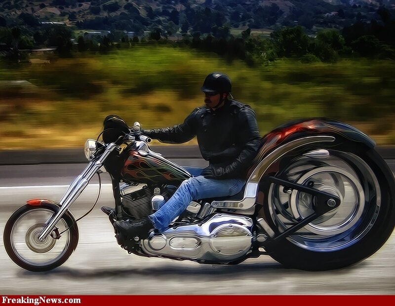 Man riding a custom motorcycle