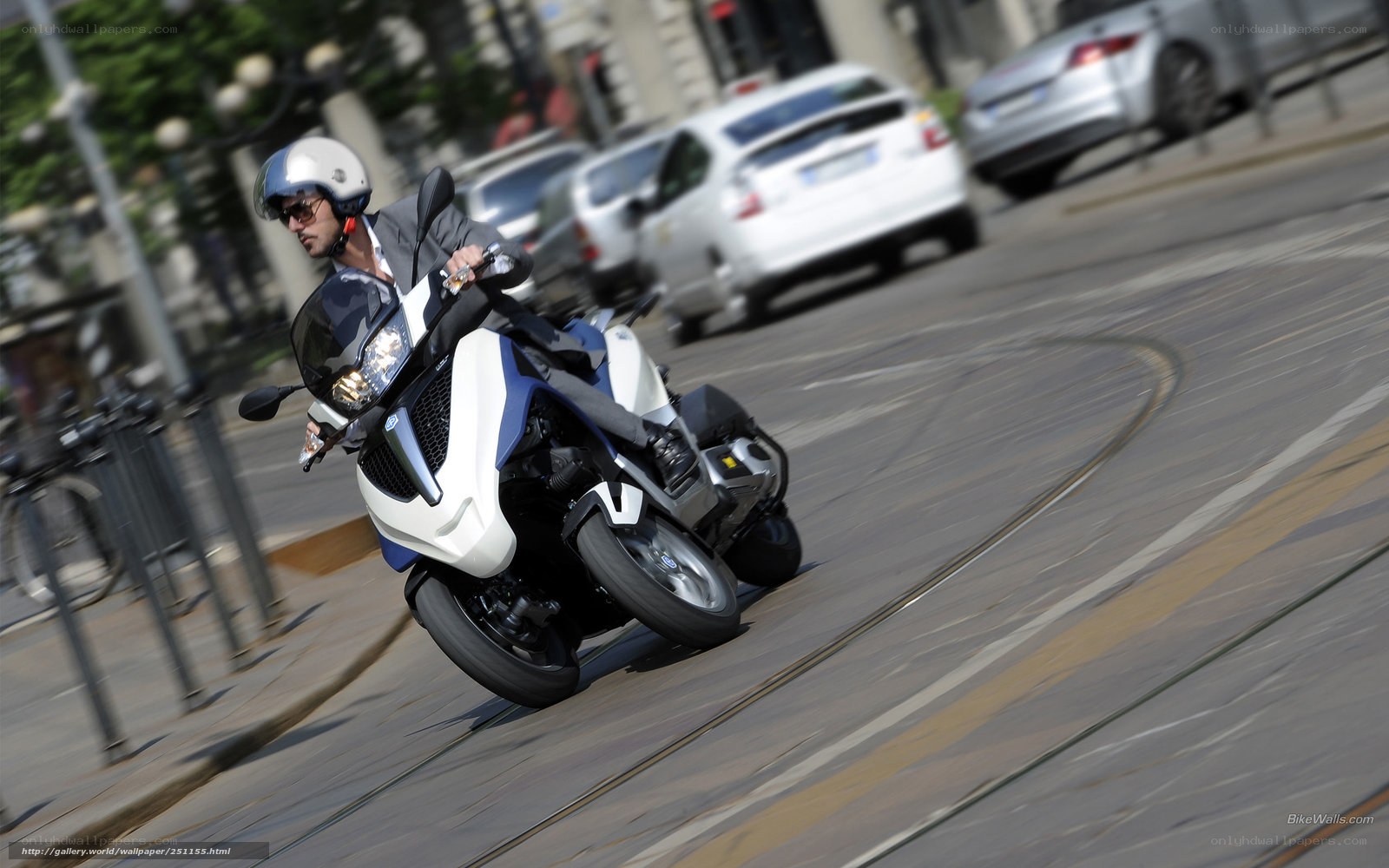 Man riding a motorcycle on a city street