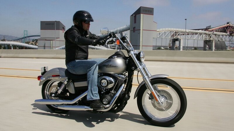 Man riding a motorcycle on a highway