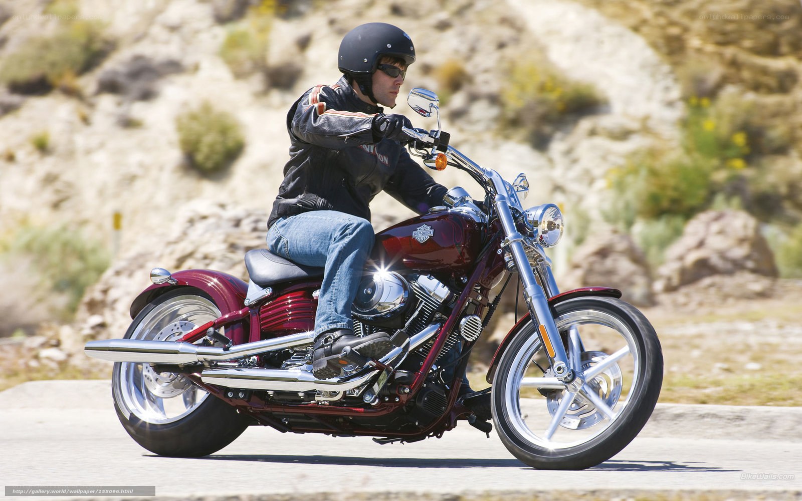 Man riding a motorcycle on a road